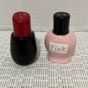 Pink nail polish and red lipstick salt and pepper shakers.